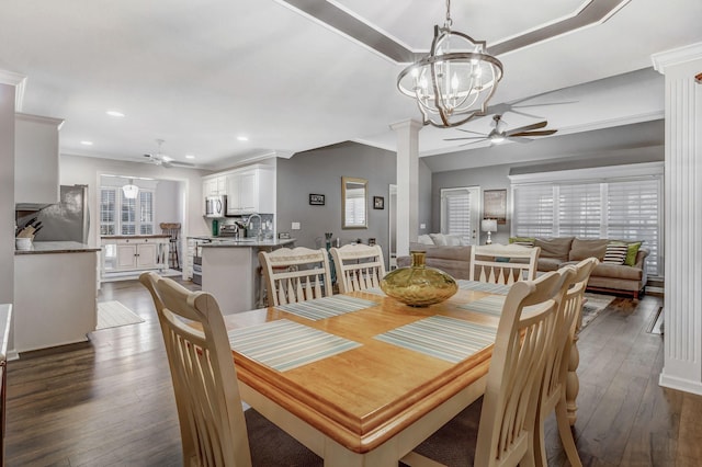 dining space with recessed lighting, crown molding, ceiling fan with notable chandelier, and dark wood-style floors