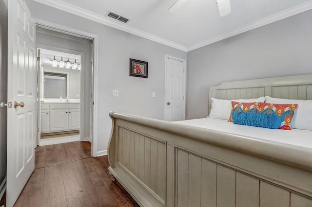 bedroom featuring visible vents, ornamental molding, baseboards, a ceiling fan, and dark wood finished floors