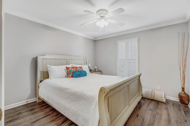 bedroom featuring baseboards, ornamental molding, and wood finished floors