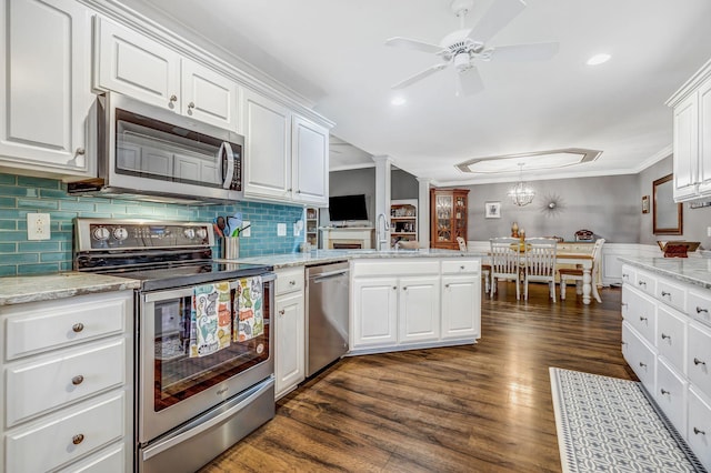kitchen featuring white cabinetry, a ceiling fan, appliances with stainless steel finishes, and a sink