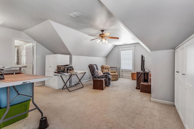 sitting room featuring light carpet, a ceiling fan, baseboards, lofted ceiling, and visible vents
