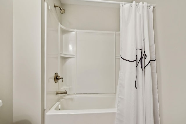 bathroom featuring shower / bath combo with shower curtain