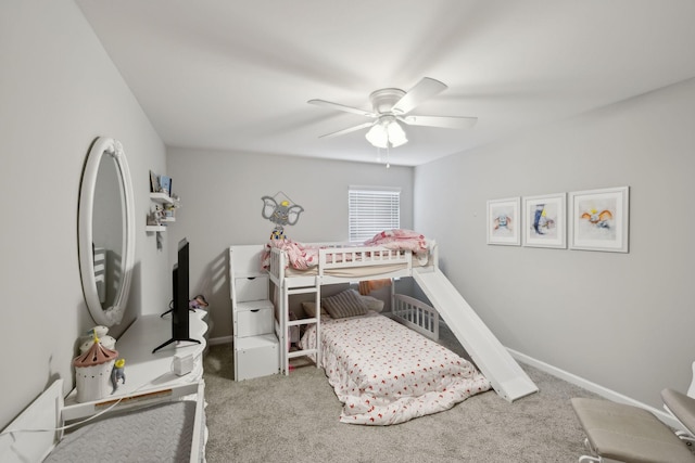 bedroom with carpet floors, ceiling fan, and baseboards