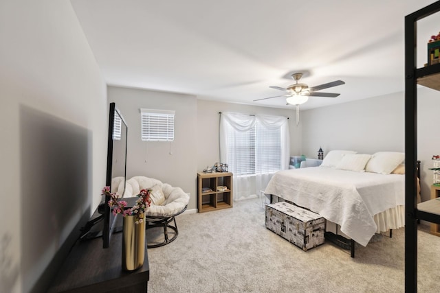 bedroom with a ceiling fan and carpet flooring