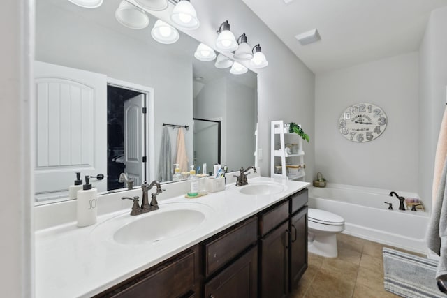 bathroom with double vanity, a sink, a bath, and tile patterned floors