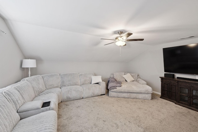 living room with ceiling fan, vaulted ceiling, carpet flooring, and visible vents