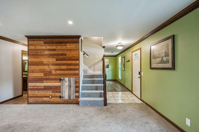 foyer with stairway, baseboards, ornamental molding, carpet, and recessed lighting