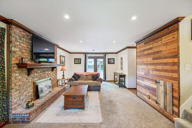 carpeted living area with crown molding, a fireplace, baseboards, stairway, and recessed lighting