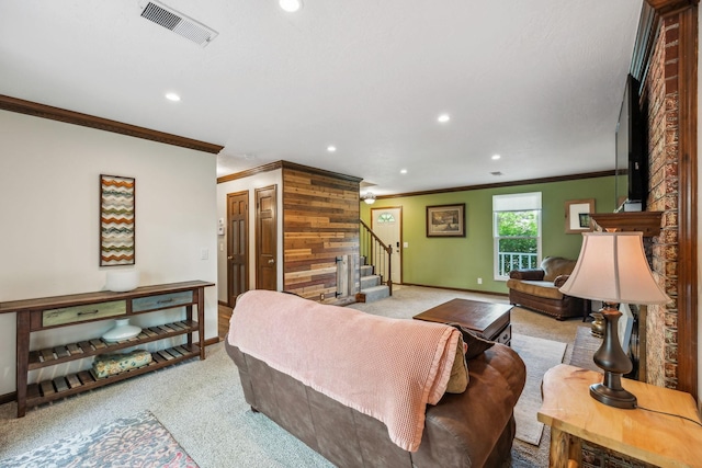 living room featuring visible vents, ornamental molding, stairway, light colored carpet, and recessed lighting