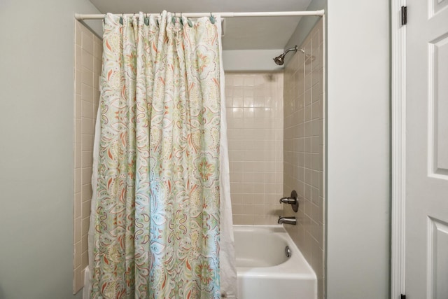 bathroom with shower / bath combination with curtain