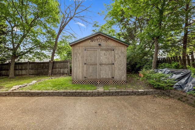 view of shed with a fenced backyard
