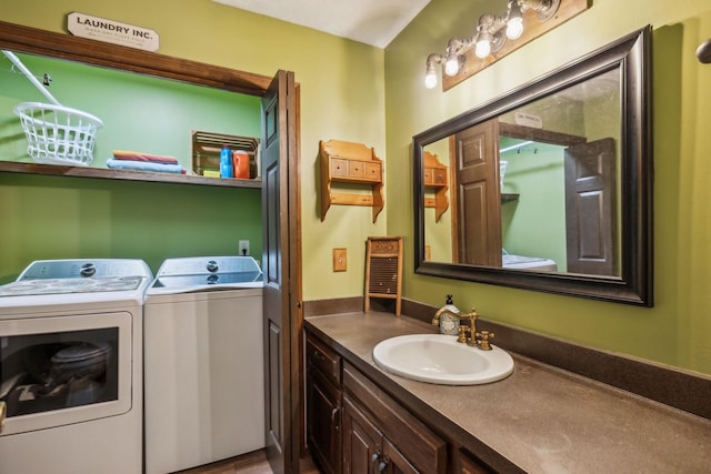 bathroom featuring separate washer and dryer and vanity