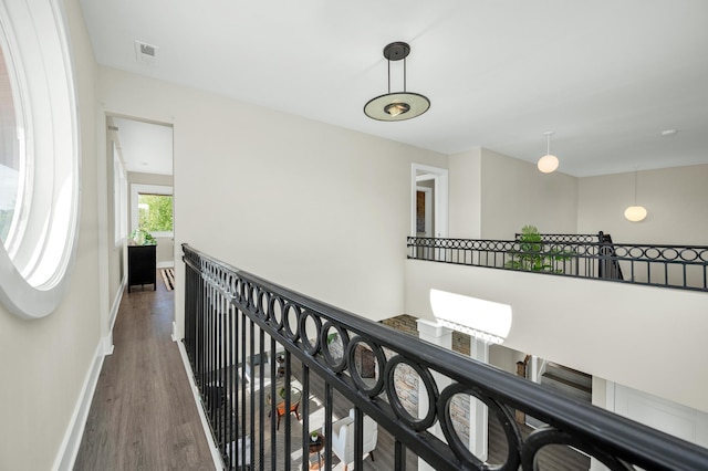 231 Wolf Ridge Ln, Lynchburg, TN 37352 - hall featuring baseboards, wood finished floors, visible vents, and an upstairs landing
