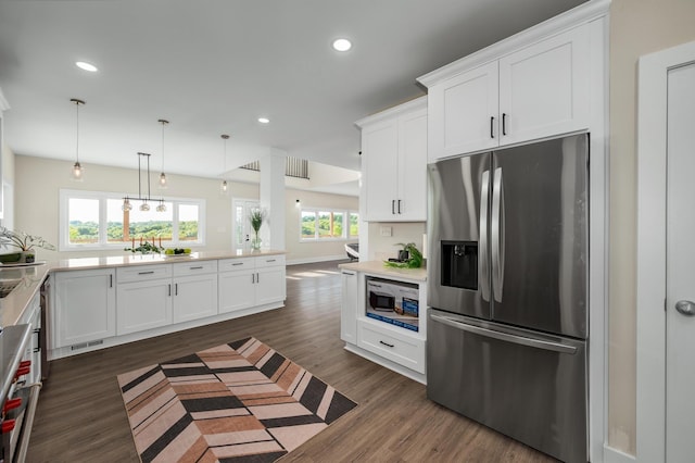 231 Wolf Ridge Ln, Lynchburg, TN 37352 - kitchen featuring white cabinets, stainless steel fridge with ice dispenser, built in microwave, recessed lighting, and dark wood-style floors