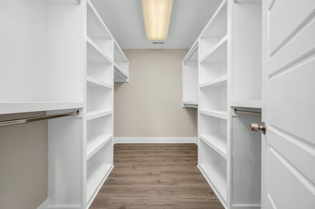 231 Wolf Ridge Ln, Lynchburg, TN 37352 - walk in closet featuring dark wood-style floors and visible vents
