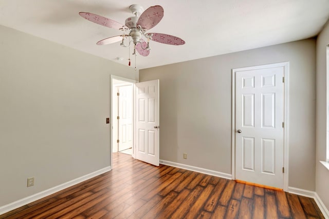 unfurnished bedroom with baseboards, ceiling fan, and wood finished floors