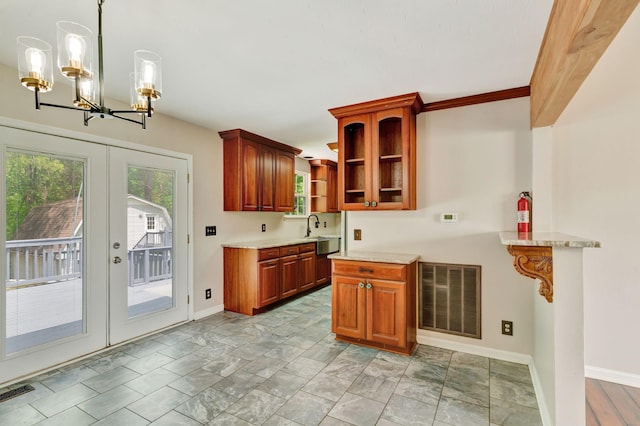 kitchen featuring french doors, visible vents, open shelves, a sink, and a notable chandelier