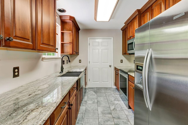 kitchen with open shelves, light stone counters, a sink, marble finish floor, and stainless steel appliances