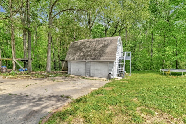 detached garage with a trampoline