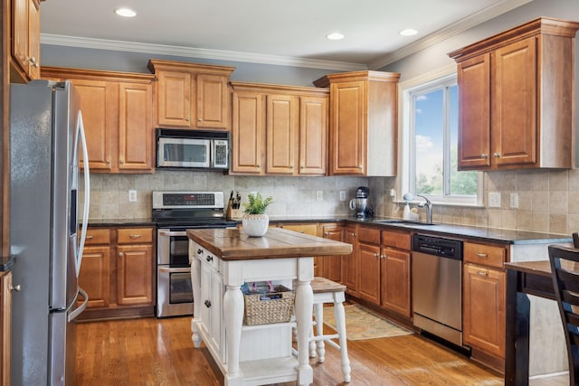 5028 Burke Trl, Nolensville, TN 37135 - kitchen with a sink, light wood-style flooring, appliances with stainless steel finishes, and dark countertops