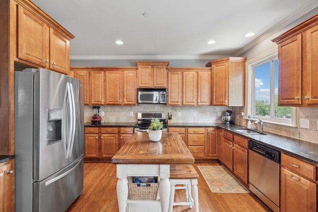 5028 Burke Trl, Nolensville, TN 37135 - kitchen featuring crown molding, appliances with stainless steel finishes, wooden counters, and a sink