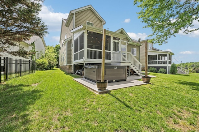 5028 Burke Trl, Nolensville, TN 37135 - rear view of house with a lawn, a sunroom, a hot tub, fence, and a patio