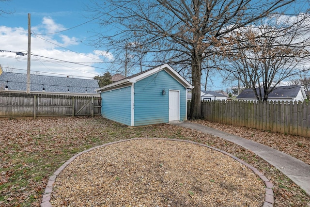 view of yard with a fenced backyard and an outdoor structure