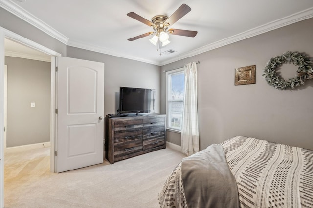 bedroom featuring visible vents, ornamental molding, baseboards, ceiling fan, and carpet flooring