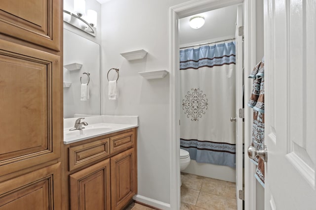 full bath featuring toilet, tile patterned flooring, and vanity