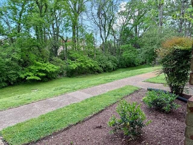 view of home's community featuring a yard