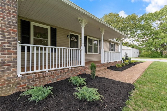 doorway to property featuring covered porch