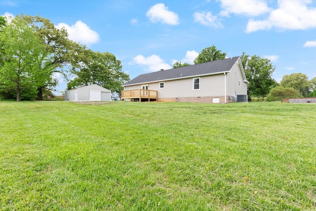 view of yard featuring central AC and a wooden deck