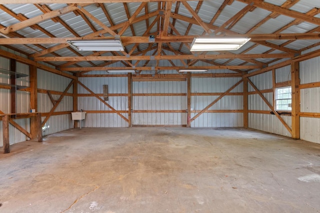 garage featuring a sink and metal wall