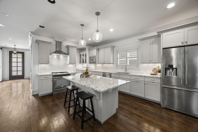 802 Montrose Ave, Nashville, TN 37204 - kitchen featuring wall chimney range hood, backsplash, stainless steel appliances, and a sink