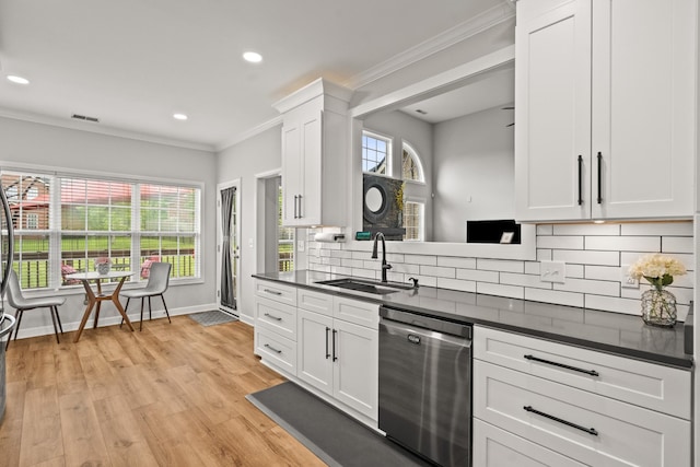 1006 Grider Dr, Gallatin, TN 37066 - kitchen featuring stainless steel dishwasher, a sink, dark countertops, crown molding, and tasteful backsplash