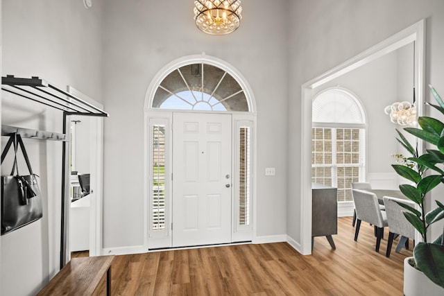 1006 Grider Dr, Gallatin, TN 37066 - foyer entrance with a chandelier, light wood finished floors, a high ceiling, and baseboards
