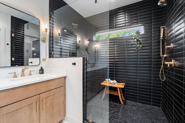 full bath featuring vanity and walk in shower