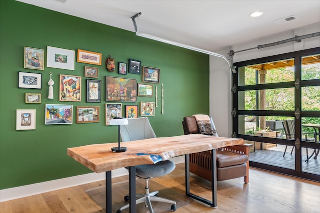 home office with recessed lighting, baseboards, visible vents, and light wood-type flooring