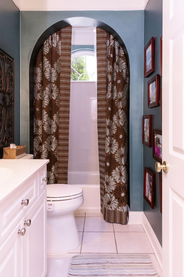 full bathroom with vanity, tile patterned flooring, toilet, and shower / tub combo with curtain