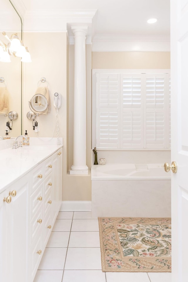 full bath featuring crown molding, vanity, tile patterned floors, decorative columns, and a bath
