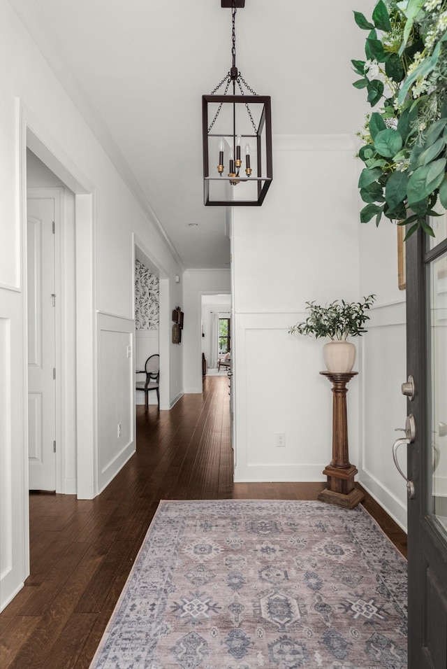 449 River Bluff Dr, Franklin, TN 37064 - foyer entrance with ornamental molding, dark wood-style flooring, and a chandelier