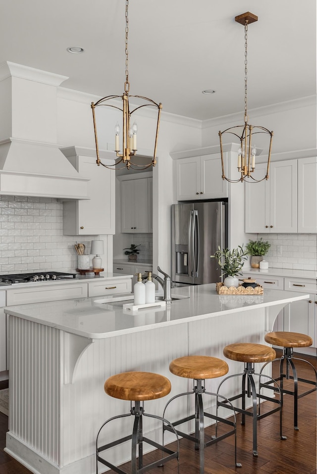 449 River Bluff Dr, Franklin, TN 37064 - kitchen with crown molding, decorative backsplash, stainless steel appliances, and a notable chandelier