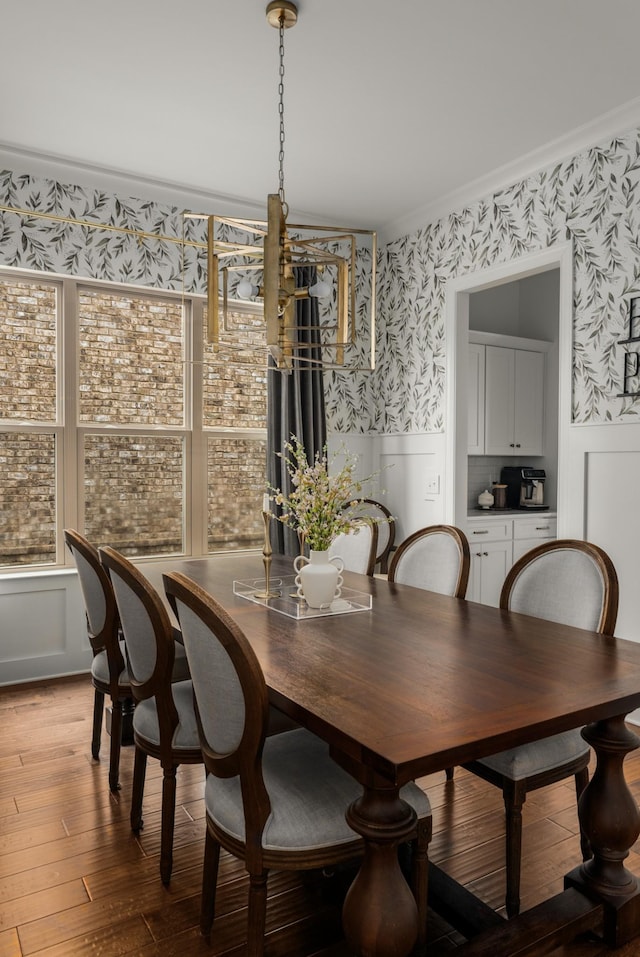 449 River Bluff Dr, Franklin, TN 37064 - dining room featuring crown molding, wainscoting, wallpapered walls, light wood-type flooring, and plenty of natural light