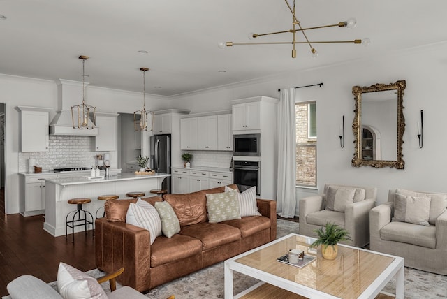 449 River Bluff Dr, Franklin, TN 37064 - living area featuring an inviting chandelier, crown molding, and dark wood-type flooring