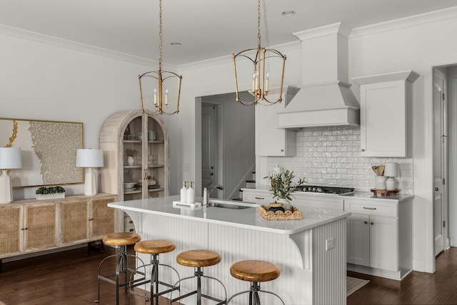449 River Bluff Dr, Franklin, TN 37064 - kitchen with premium range hood, a center island with sink, gas stovetop, tasteful backsplash, and a sink