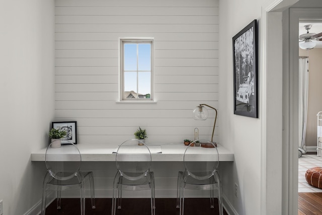 449 River Bluff Dr, Franklin, TN 37064 - office featuring baseboards, wood walls, and wood finished floors