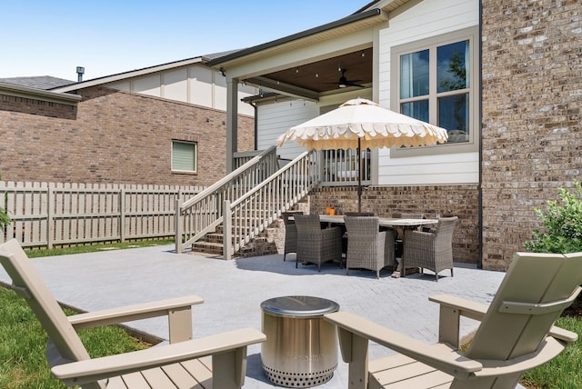 449 River Bluff Dr, Franklin, TN 37064 - view of patio with fence, outdoor dining space, ceiling fan, and a fire pit