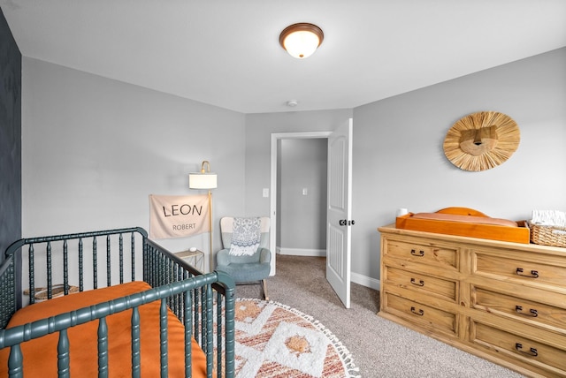 carpeted bedroom featuring baseboards