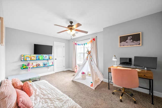 carpeted bedroom featuring baseboards and ceiling fan