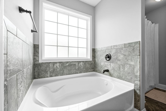 full bathroom featuring a bath